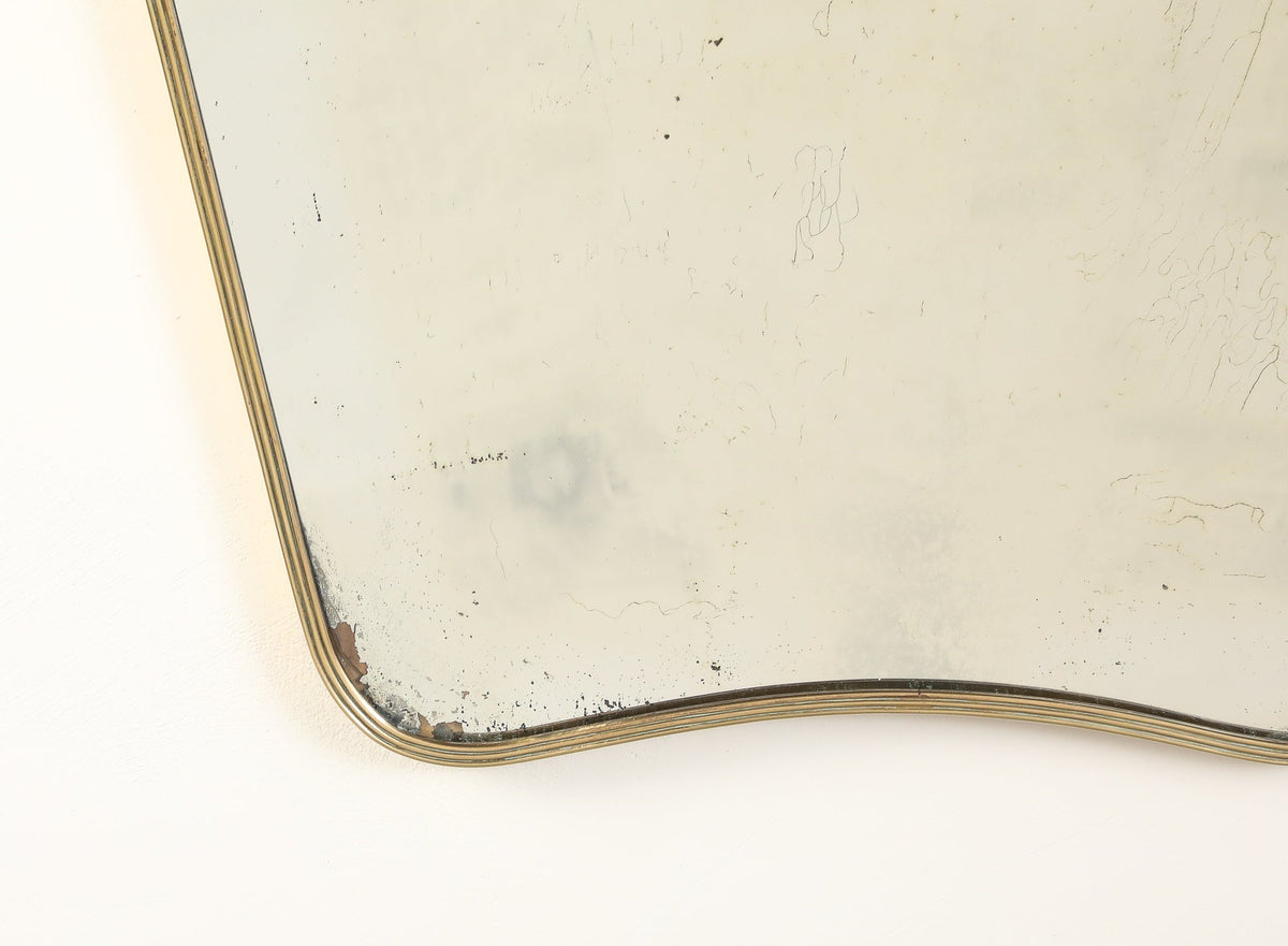 Luigi Fontana 1940's Brass Shaped Wall Mirror with Decorative Scroll Crest
