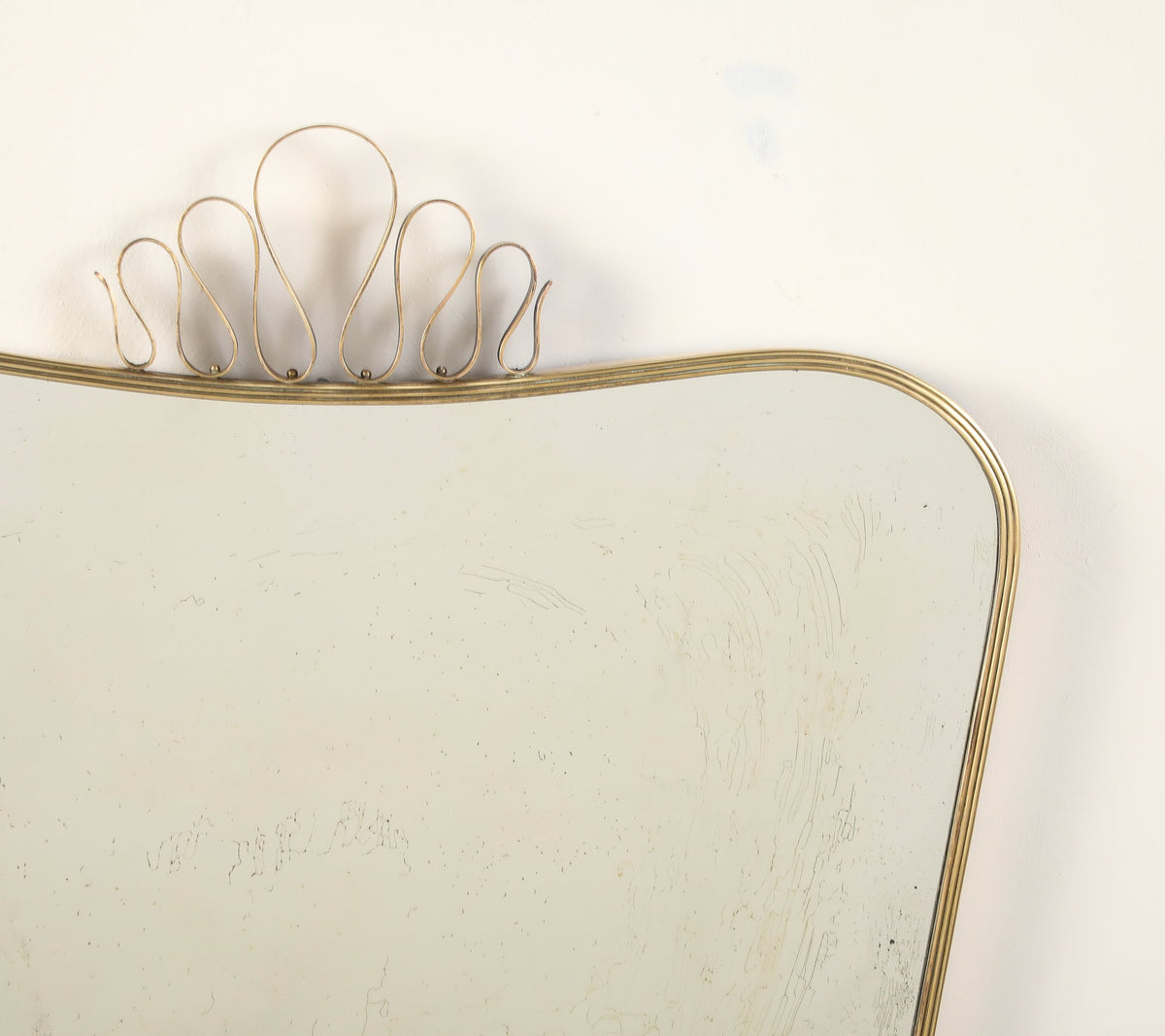 Luigi Fontana 1940's Brass Shaped Wall Mirror with Decorative Scroll Crest