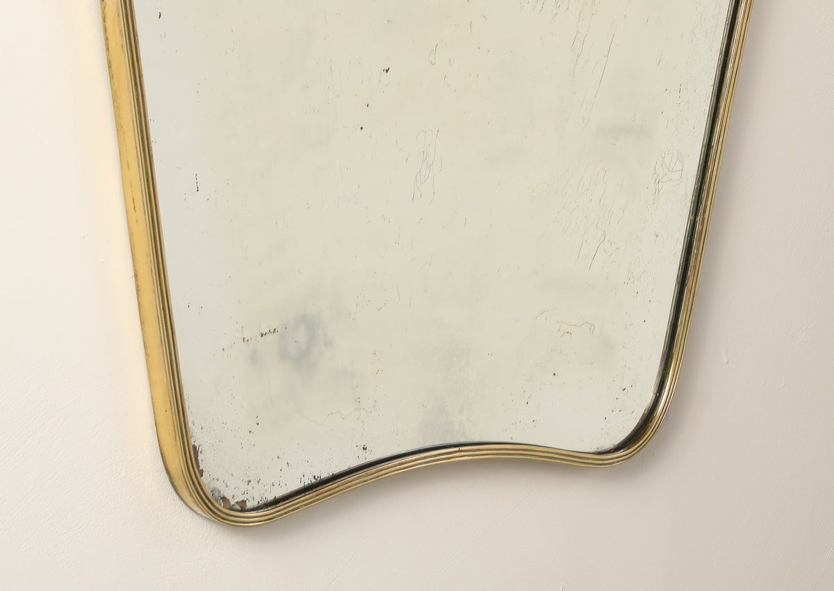 Luigi Fontana 1940's Brass Shaped Wall Mirror with Decorative Scroll Crest