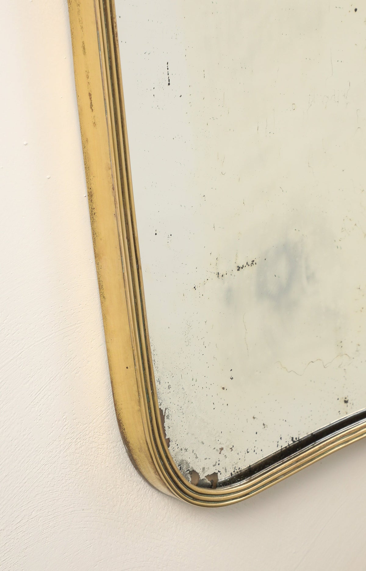 Luigi Fontana 1940's Brass Shaped Wall Mirror with Decorative Scroll Crest
