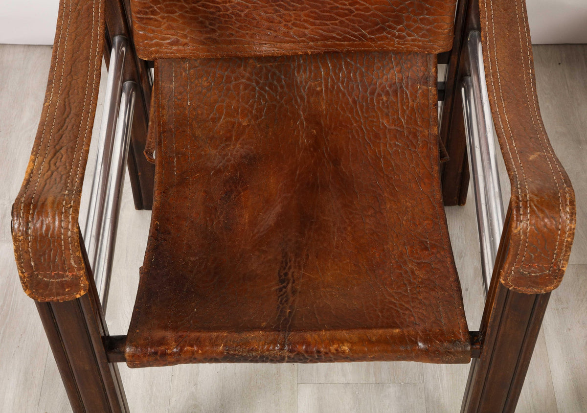 Pair of Spanish 1920's Pebbled Leather and Chrome Safari Armchairs