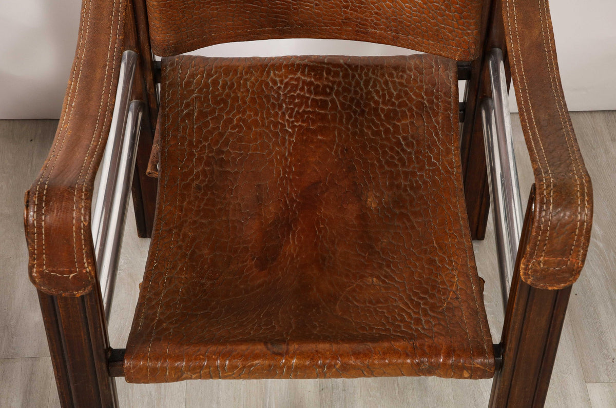 Pair of Spanish 1920's Pebbled Leather and Chrome Safari Armchairs